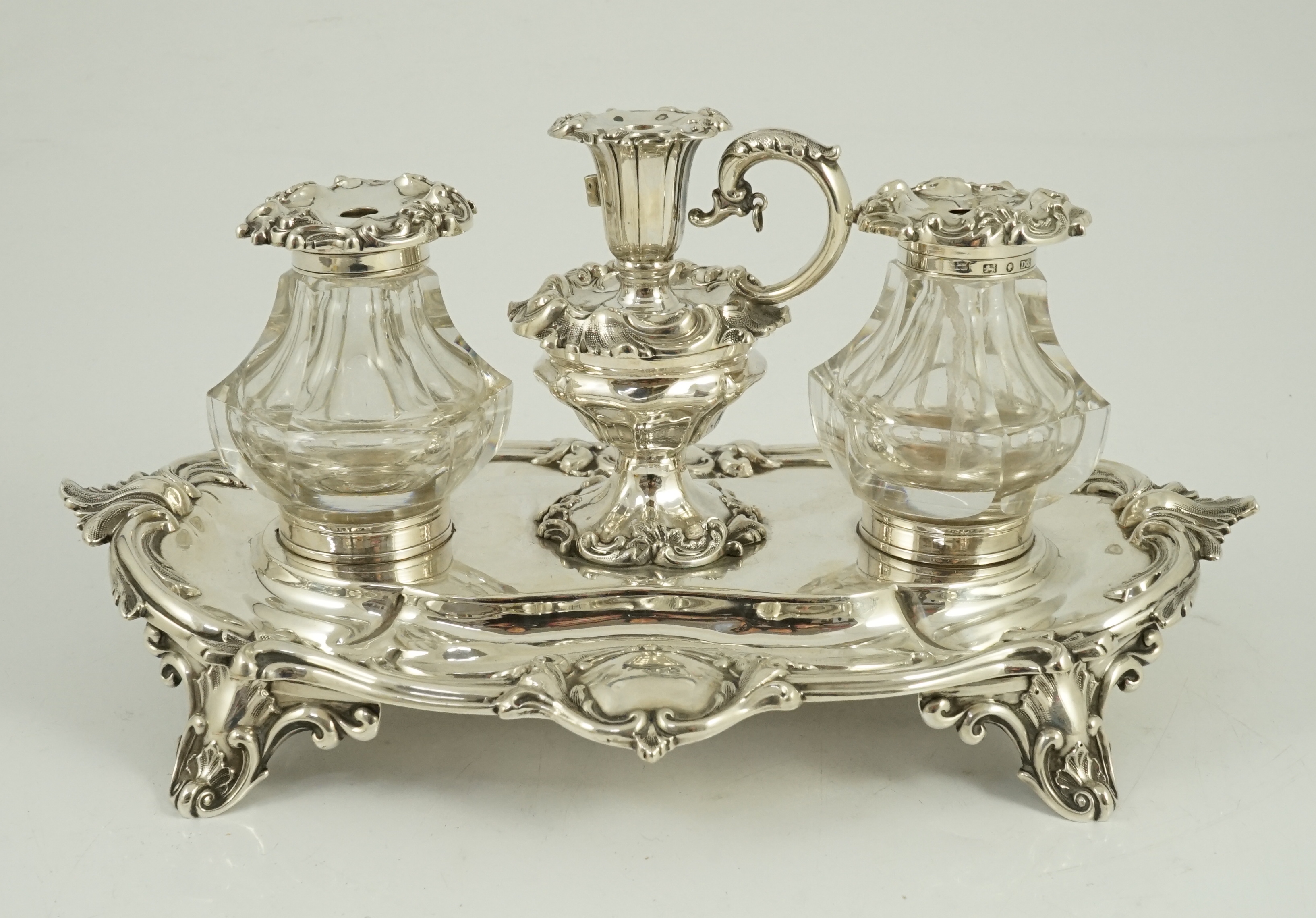 An ornate Victorian silver oval inkstand, by Henry Wilkinson & Co